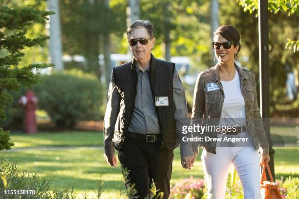 John Henry, principal owner of Liverpool Football Club, the Boston Red Sox and The Boston Globe and co-owner of Roush Fenway Racing, walks with his...
