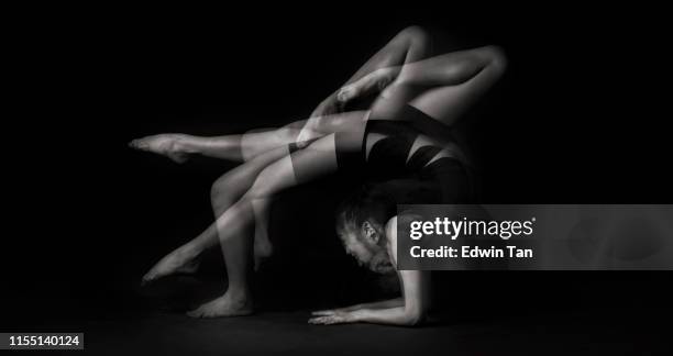 a studio shoot with multiple exposure black and white image with gymnastic posing - multiple exposure sports stock pictures, royalty-free photos & images