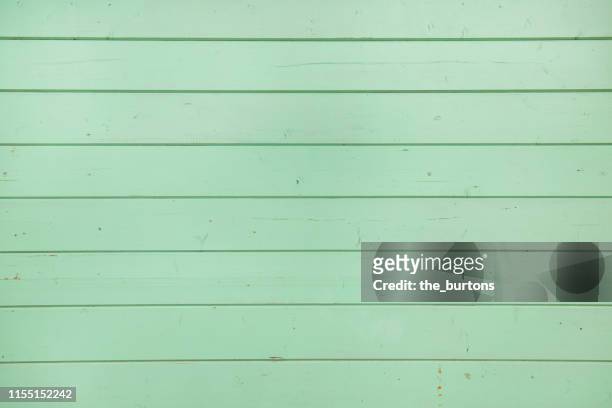 full frame shot of turquoise wooden wall - blue wood stock pictures, royalty-free photos & images
