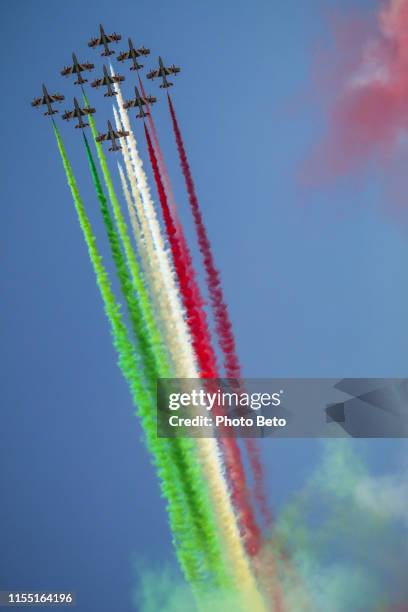 the italian acrobatic air patrol of the frecce tricolori crosses the skies of rome - airshow stock pictures, royalty-free photos & images