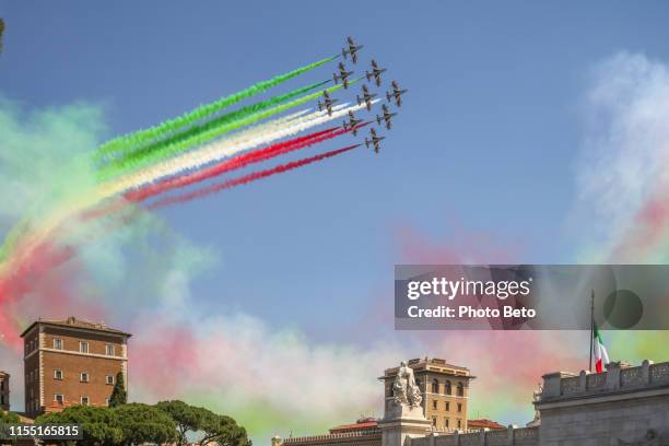 the italian acrobatic air patrol of the frecce tricolori crosses the skies of rome - italian military stock pictures, royalty-free photos & images