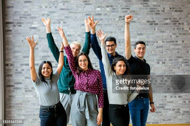happy business people celebrating success at office - organised group photo stock pictures, royalty-free photos & images
