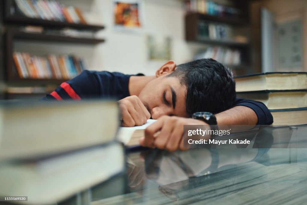Portrait of teenage boy in the library
