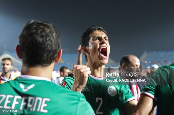 Algeria's defender Aissa Mandi celebrates after winning the 2019 Africa Cup of Nations quarter final football match between Ivory Coast and Algeria...