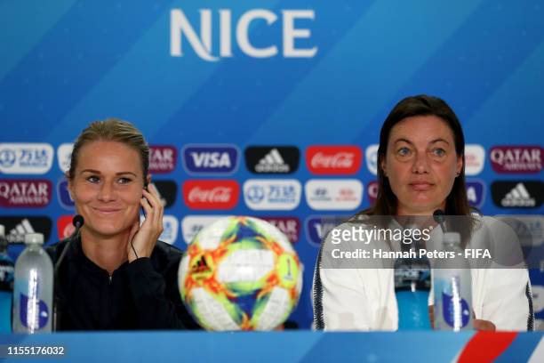 Amandine Henry and Corinne Diacre, head coach of France answer questions from the media during a press conference at Stade de Nice on June 11, 2019...