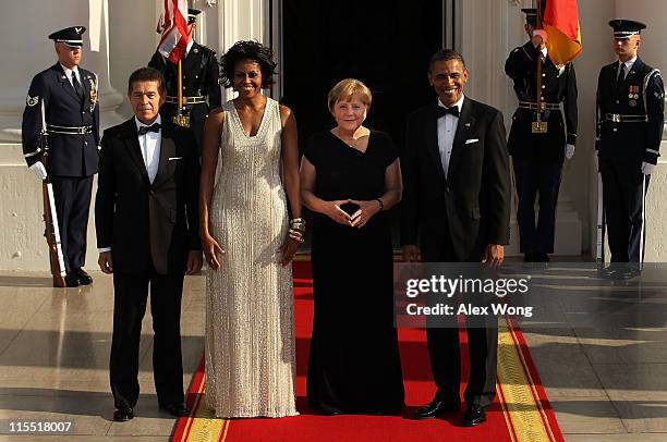 President Barack Obama , first lady Michelle Obama , German Chancellor Angela Merkel and her husband Joachim Sauer pose for photographs on the North...