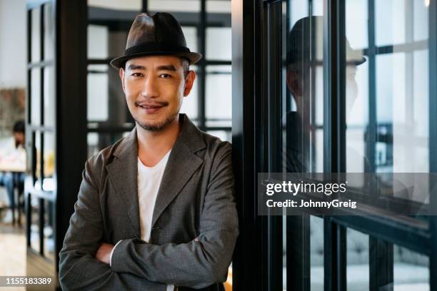 asian hipster businessman portrait smiling - trilby hat stock pictures, royalty-free photos & images