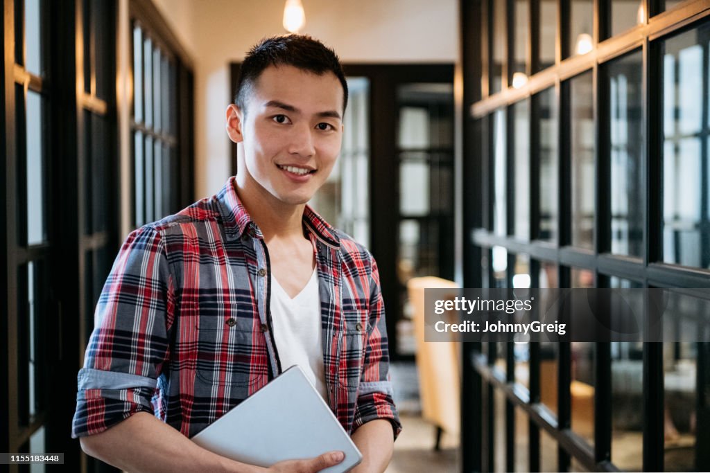 Portrait of cool young Chinese businessman