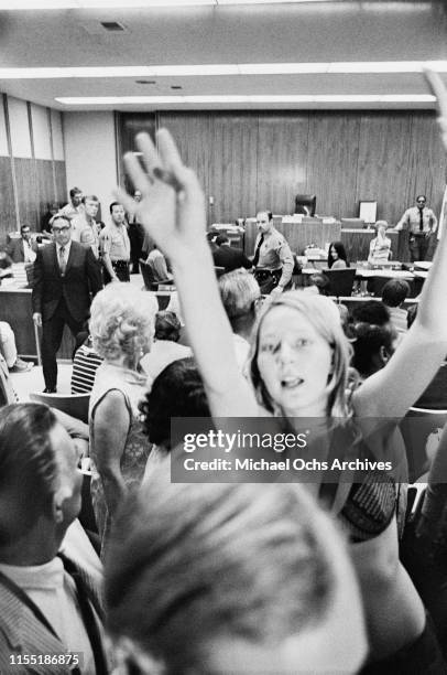 Woman, possibly member of the Manson Family Catherine Gillies , tries to catch the attention of reporters during a hearing regarding the murder of...