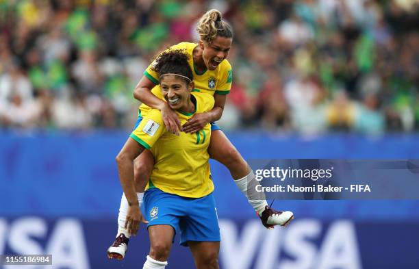 Cristiane of Brazil celebrates after scoring her team's third goal with teammate Tamires during the 2019 FIFA Women's World Cup France group C match...