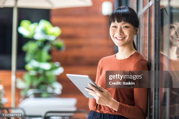 portrait of a young asian female entrepreneur. - east asian culture stock pictures, royalty-free photos & images