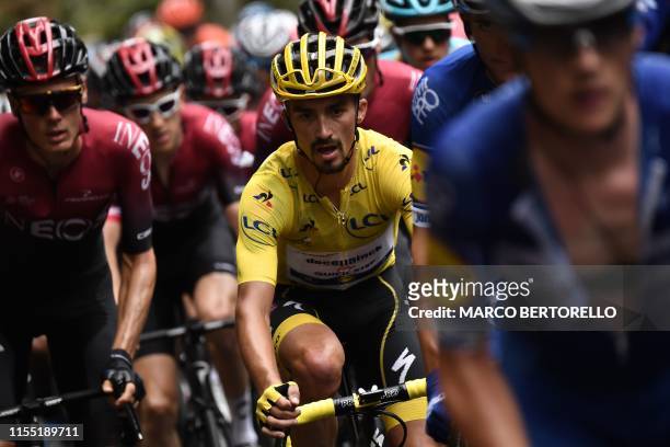 France's Julian Alaphilippe , wearing the overall leader's yellow jersey rides in the pack during the sixth stage of the 106th edition of the Tour de...