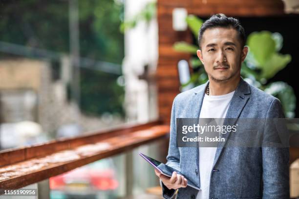 portrait of a asian entrepreneur. - chinese ethnicity stock pictures, royalty-free photos & images