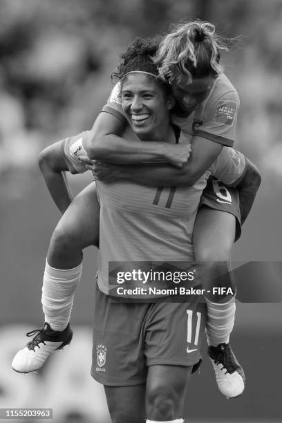 Cristiane of Brazil celebrates after scoring her team's third goal with teammate Tamires during the 2019 FIFA Women's World Cup France group C match...