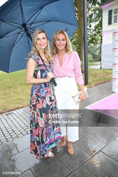 Tanja Buelter and Caroline Beil during the Ernsting's family Fashion Show 2019 on July 11, 2019 in Hamburg, Germany.