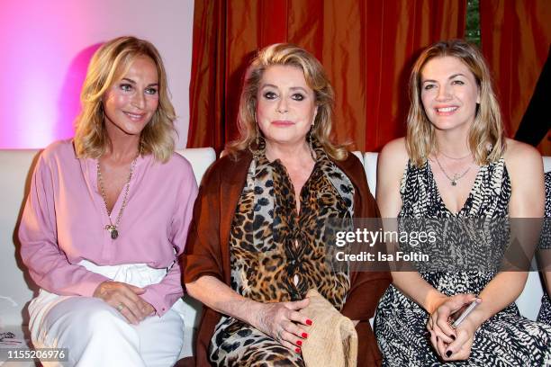 Caroline Beil, Catherine Deneuve and Nina Bott during the Ernsting's family Fashion Show 2019 on July 11, 2019 in Hamburg, Germany.