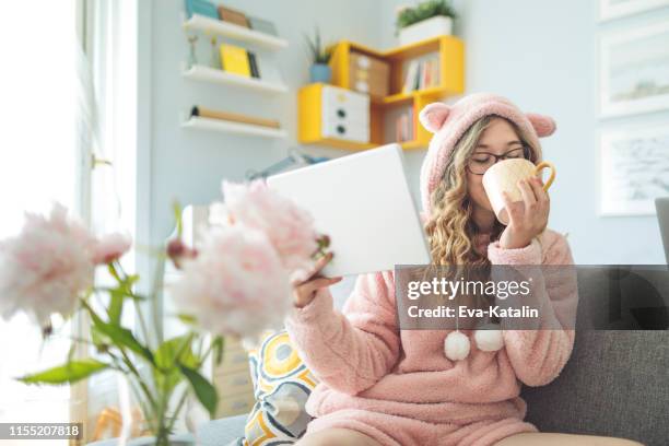 young woman at home - luxury pyjamas stock pictures, royalty-free photos & images