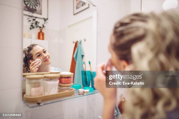 young woman at home - bathroom routine stock pictures, royalty-free photos & images