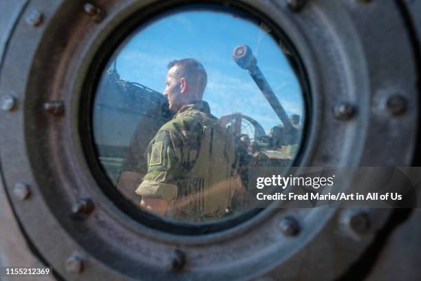 A french soldier with a tank behind him getting ready for the Amphibious Bold Alligator Exercise organized by the US Navy and the Marine Corps on the...