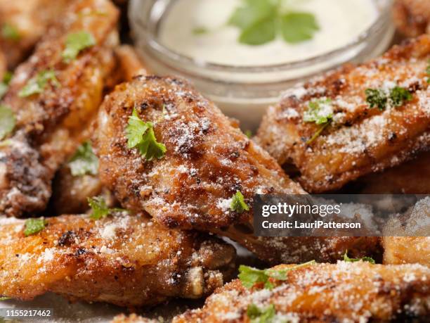 air fried, garlic and parmesan crispy chicken wings with ranch dip - ranch dressing stock pictures, royalty-free photos & images