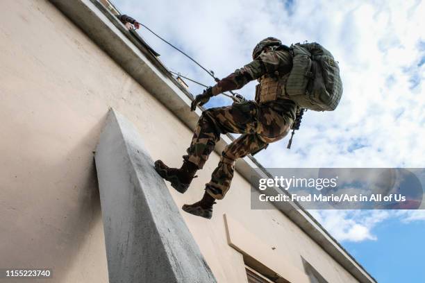 A group of soldiers training for abseil from on a roof in a training camp for the sentinelle operation, Occitanie, Toulouse, France on november 30,...