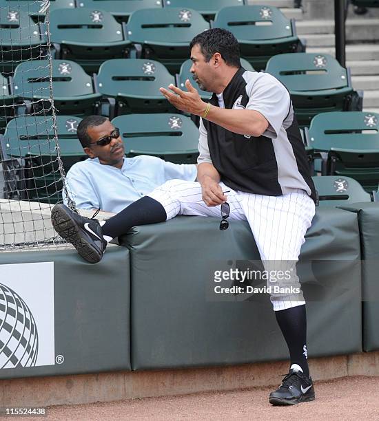 Ozzie Guillen manager of the Chicago White Sox talks with White Sox General Manager Ken Williams before the game against the Seattle Mariners on June...
