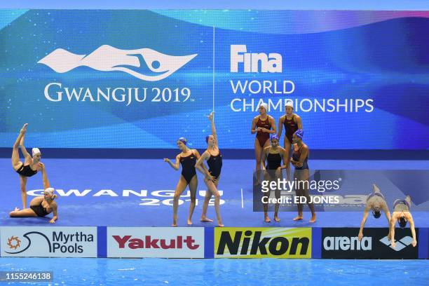 Athletes prepare to compete in the duet technical artistic swimming event during the 2019 World Championships at Yeomju Gymnasium in Gwangju on July...