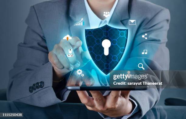 shield internet phone smartphone is protected from hacker attacks, firewall businesspeople press the protected phone on the internet. space put message - antivirus software stock pictures, royalty-free photos & images