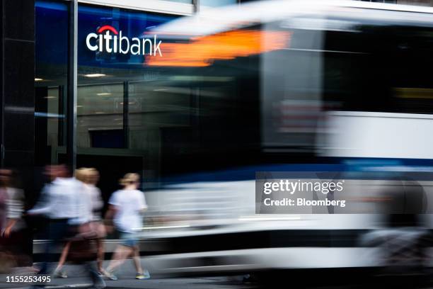 Pedestrians pass a Citigroup Inc. Bank branch in New York, U.S., on Wednesday, July 3, 2019. Citigroup Inc. Is scheduled to release earnings figures...