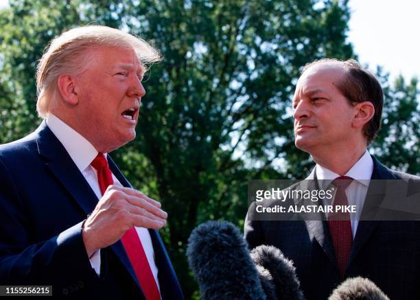 President Donald Trump flanked by US Labor Secretary Alexander Acosta speaks to the media early July 12, 2019 at the White House in Washington, DC. -...