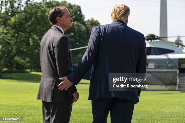 Alex Acosta, U.S. Secretary of Labor, left, stands after announcing his resignation with U.S. President Donald Trump stands in Washington, D.C.,...