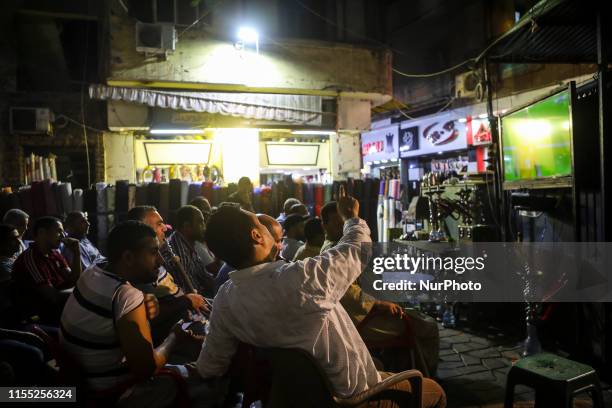 People look the quarter of final match Costa d'Avorio vs Algeria in the street of Cairo, in Bab el-Shaaria quartier, Il Cairo, Egypt on 11 July 2019....