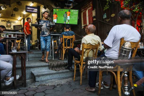 People look the quarter of final match Costa d'Avorio vs Algeria in the street of Cairo, in Bab el-Shaaria quartier, Il Cairo, Egypt on 11 July 2019....