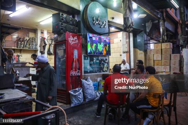 People look the quarter of final match Costa d'Avorio vs Algeria in the street of Cairo, in Bab el-Shaaria quartier, Il Cairo, Egypt on 11 July 2019....