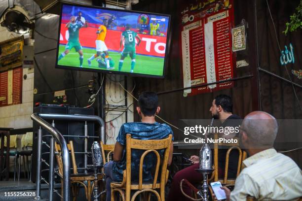 People look the quarter of final match Costa d'Avorio vs Algeria in the street of Cairo, in Bab el-Shaaria quartier, Il Cairo, Egypt on 11 July 2019....