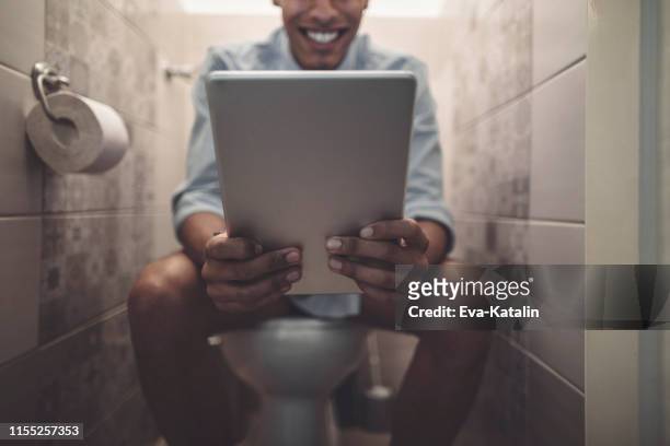 young man at home - men taking a dump stock pictures, royalty-free photos & images