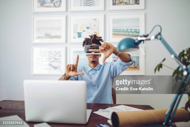 young man at home - flying goggles stock pictures, royalty-free photos & images