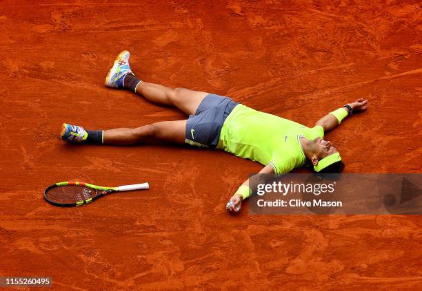 Rafael Nadal of Spain celebrates match point following the mens singles final against Dominic Thiem of Austria during Day fifteen of the 2019 French...