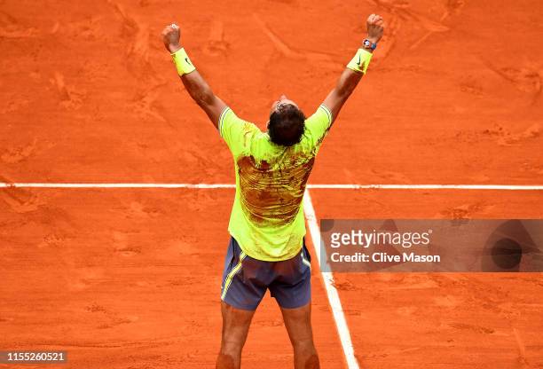 Rafael Nadal of Spain celebrates following the mens singles final against Dominic Thiem of Austria during Day fifteen of the 2019 French Open at...