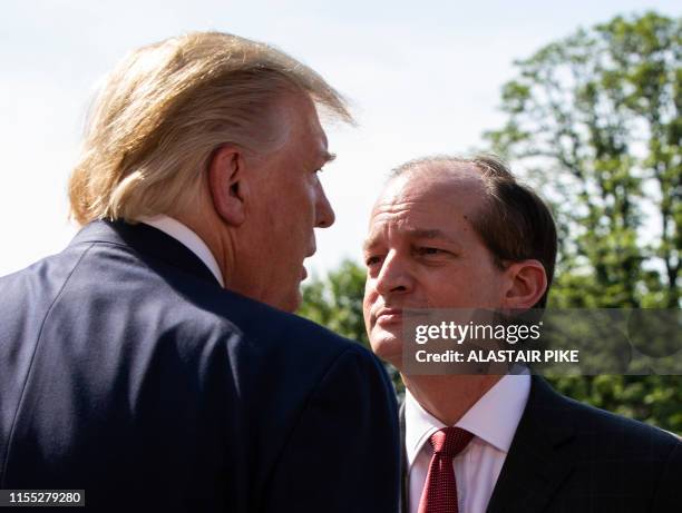 President Donald Trump flanked by US Labor Secretary Alexander Acosta speaks to the media early July 12, 2019 at the White House in Washington, DC. -...