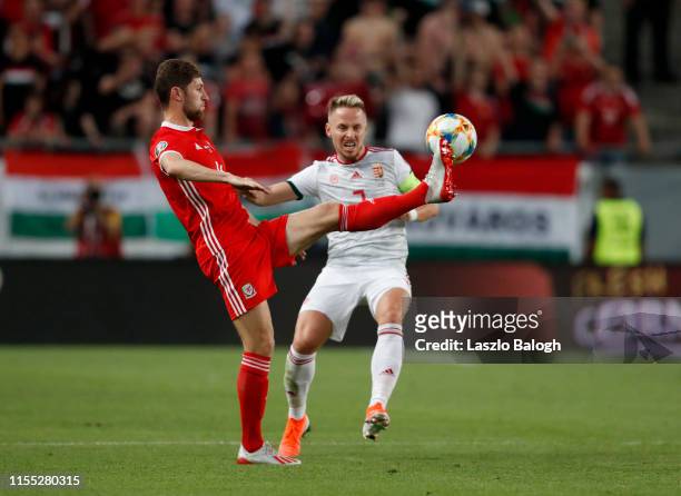 Balazs Dzsudzsak of Hungary and Ben Davies of Wales compete for the ball during the UEFA Euro 2020 Qualifier between Hungary and Wales at Groupama...