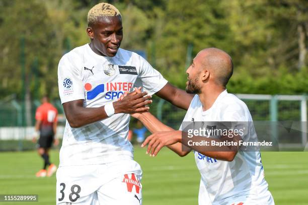 Ulrick Eneme Ella and Haitam Aleesami of Amiens celebrate during the pre-season friendly match between Amiens and Boulogne-sur-mer on July 12, 2019...