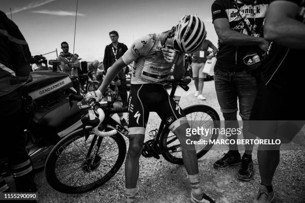 France's Julian Alaphilippe, wearing the overall leader's yellow jersey reacts after crossing the finish line of the sixth stage of the 106th edition...
