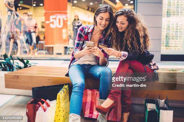 mall shopping - buying stock pictures, royalty-free photos & images