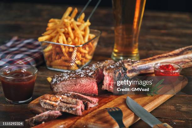 tomahawk steak with french fries - cooking french fries stock pictures, royalty-free photos & images