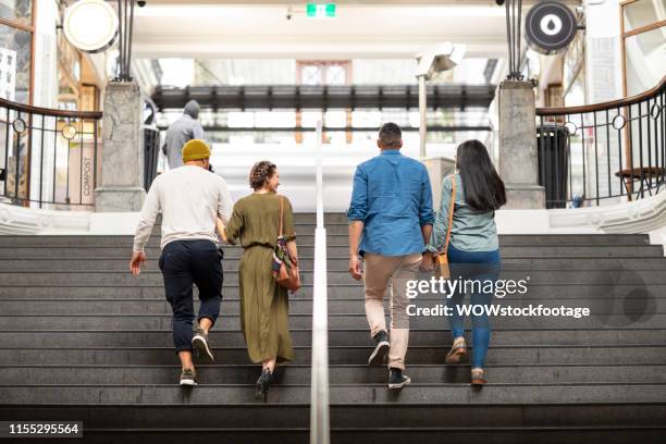 friends walk up historic arcade stairs - auckland city people stock pictures, royalty-free photos & images