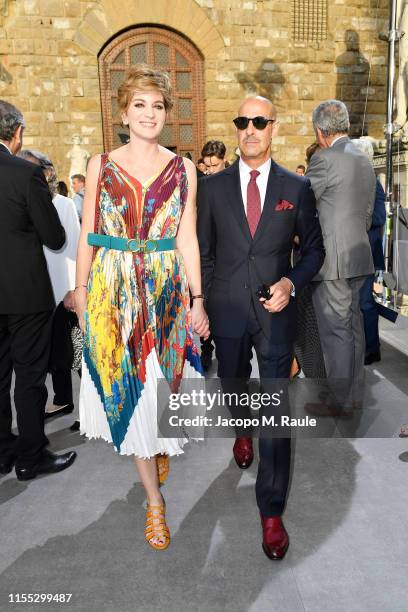 Felicity Blunt and Stanley Tucci attend the Salvatore Ferragamo show during Pitti Immagine Uomo 96 on June 11, 2019 in Florence, Italy.