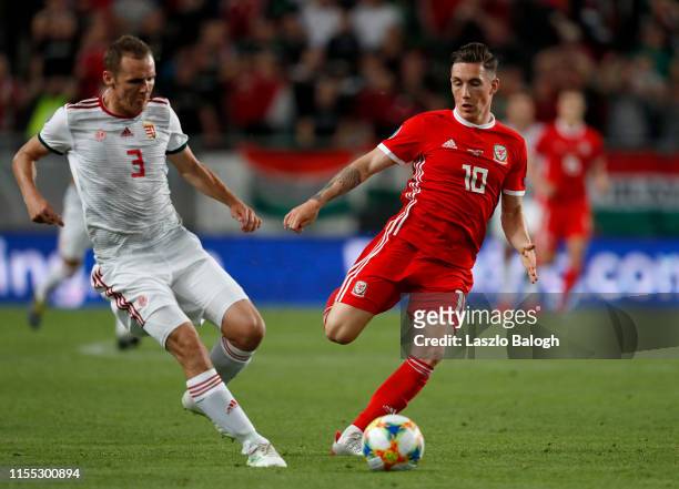 Mihaly Korhut of Hungary and Harry Wilson of Wales compete for a header during the UEFA Euro 2020 Qualifier between Hungary and Wales at Groupama...