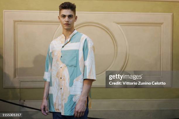 Hero Fiennes Tiffin poses during the Salvatore Ferragamo backstage in Piazza della Signoria during Pitti Immagine Uomo 96 on June 11, 2019 in...