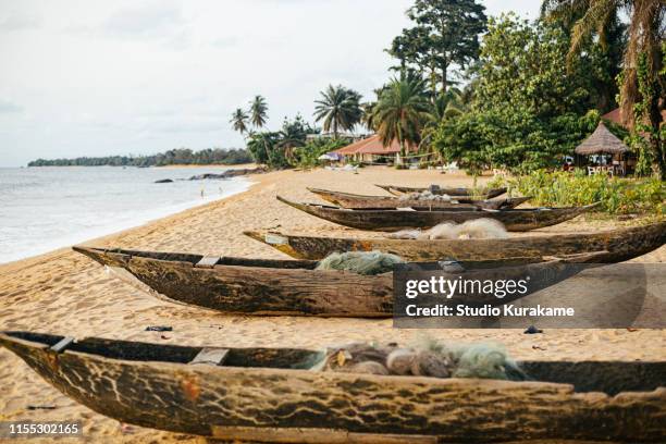 beach, kribi, cameroon - dugout canoe stock pictures, royalty-free photos & images